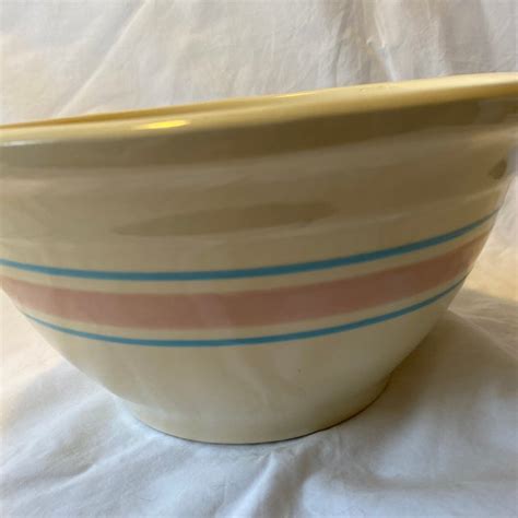 The round, beige bowls with pink and blue stripes/bands add a touch of farmhouse style to your kitchen. . Mccoy ovenware